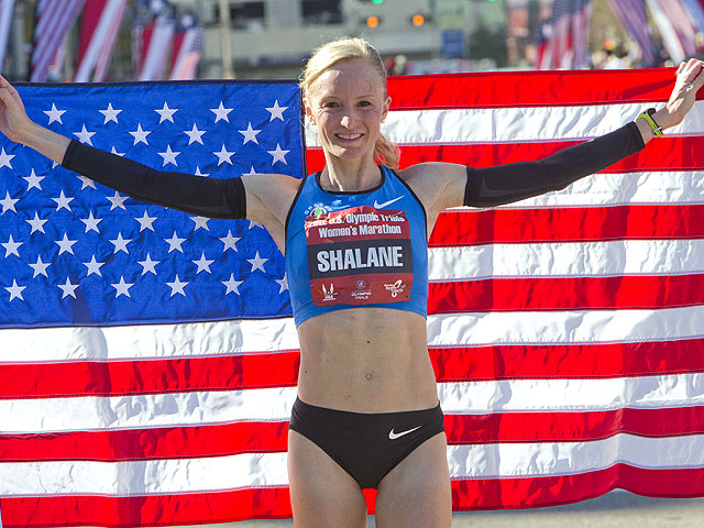Shalane Flanagan poses with the America flag after winning the U.S. Marathon Olympic Trials Women's Division in 2:25:38 on January 14, 2012 in Houston, Texas. (Photo by Bob Levey/Getty Images)