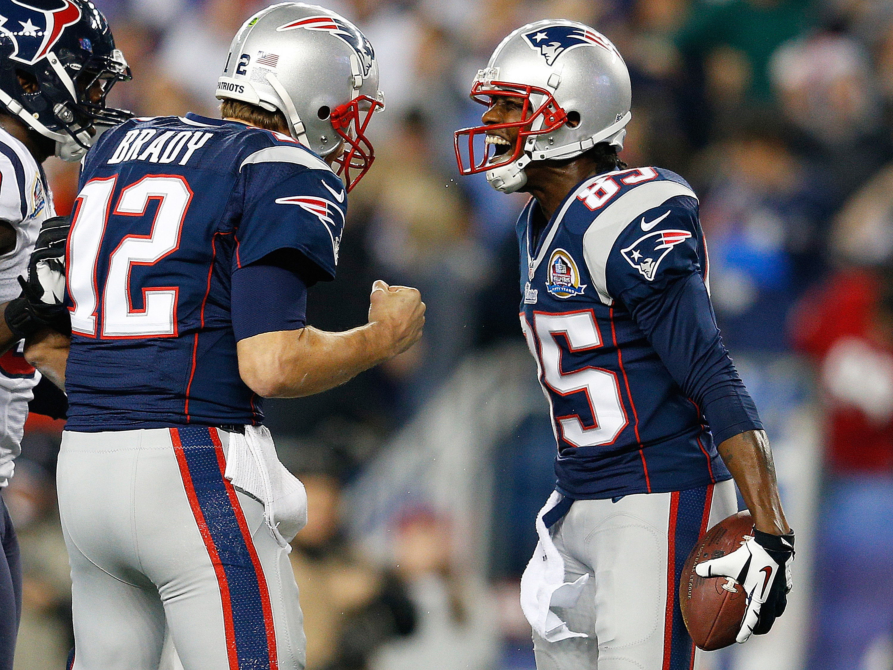 Tom Brady and Brandon Lloyd (Photo by Jim Rogash/Getty Images)