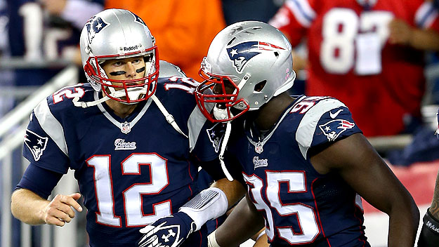 Patriots Tom Brady and Kenbrell Thompkins celebrate after New England's comeback win over the New Orleans Saints. (Photo by Elsa/Getty Images)