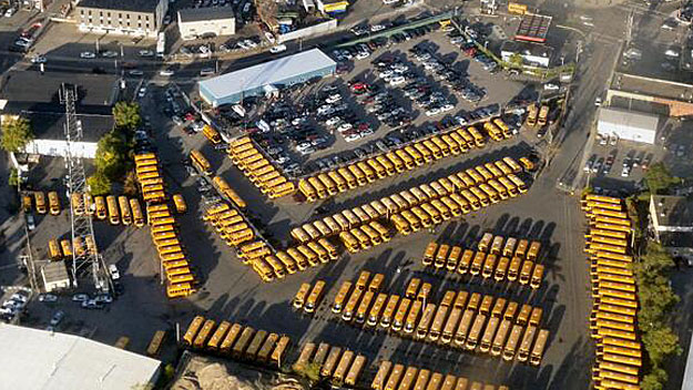 School buses parked at the Freeport Street lot in Dorchester. (Photo by Scott Eck - WBZ NewsRadio 1030) 