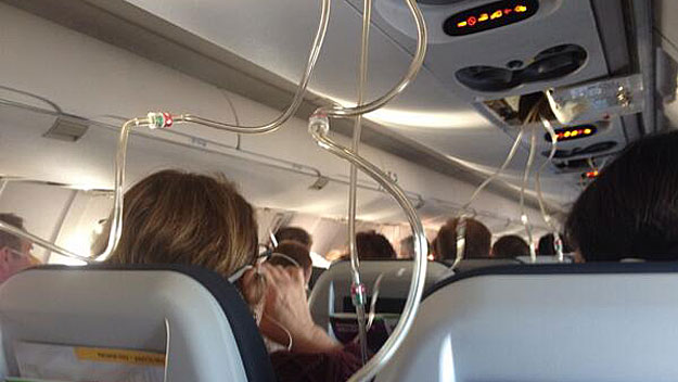 Oxygen masks deployed inside the jet during the emergency landing. (Photo courtesy: SaraBTweets)