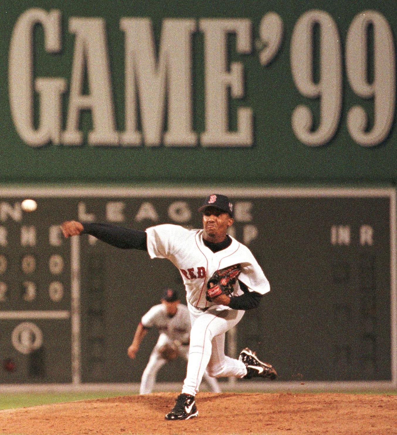 Pedro Martinez pitches in the 1999 All-Star Game at Fenway Park, with Nomar Garciaparra behind him at shortstop. (Photo by Bill Polo/AFP/Getty Images)