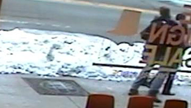 A man seen in this surveillance image sucker punching a man on Mass. Ave in Cambridge, Feb. 15. (Image courtesy: BoConcept)