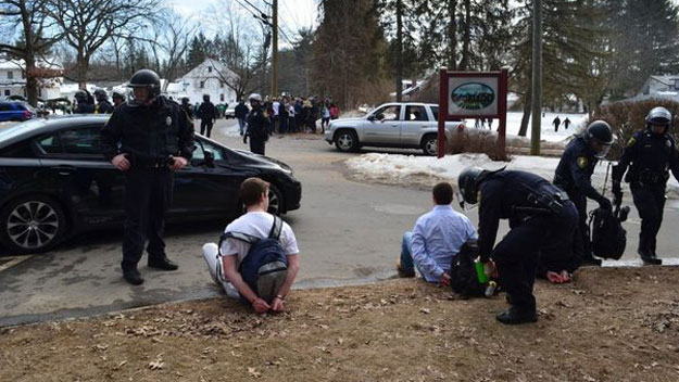 Police place students under  arrest after the Blarney Blowout got out of control. (Photo by Robert Rizzuto/MassLive.com)
