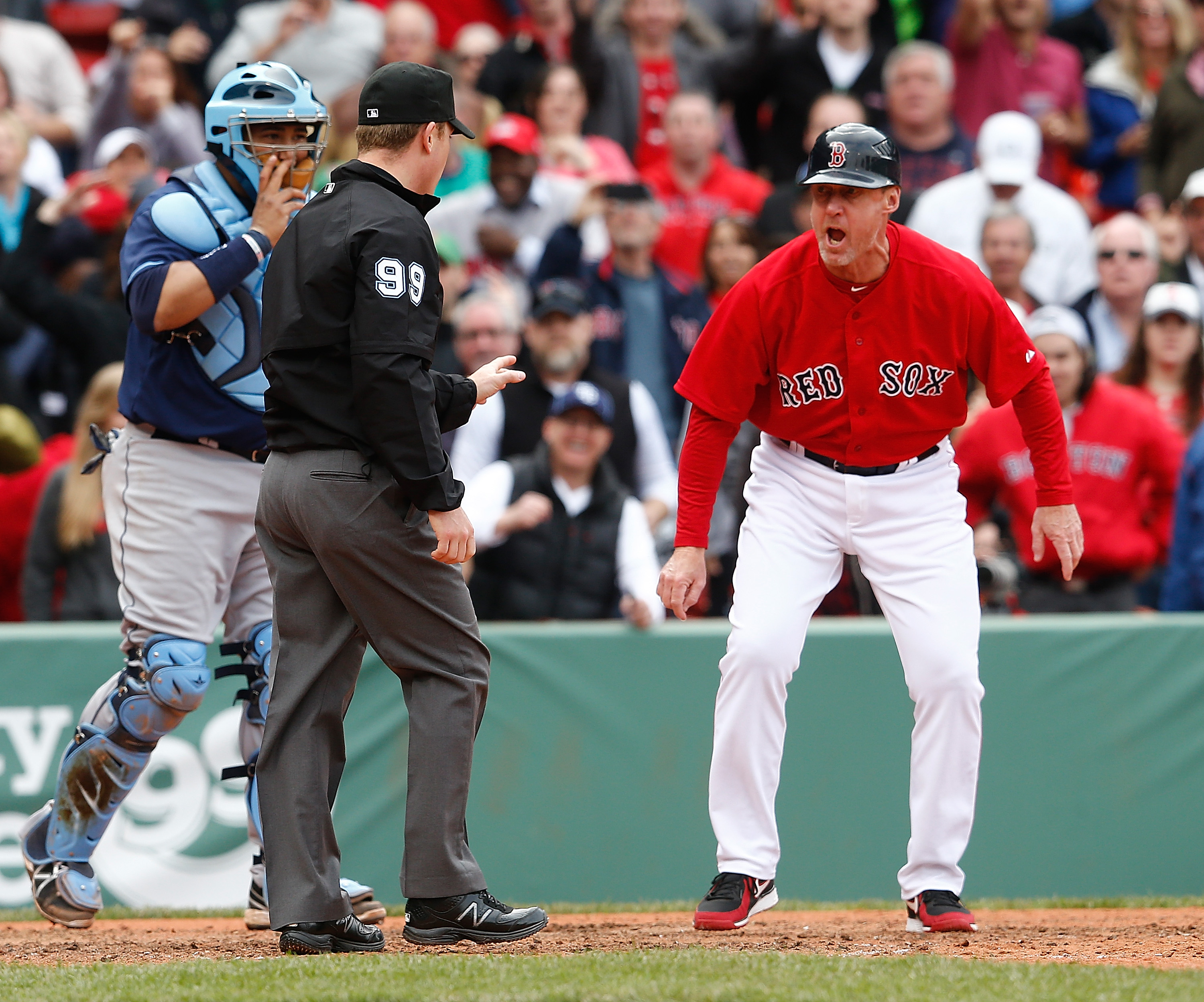 Red Sox third base coach Brian Butterfield reacts after umpire Toby Basner called Dustin Pedroia out on a play at home plate against the Tampa Bay Rays. Butterfield was later ejected from the game. (Photo by Jim Rogash/Getty Images)