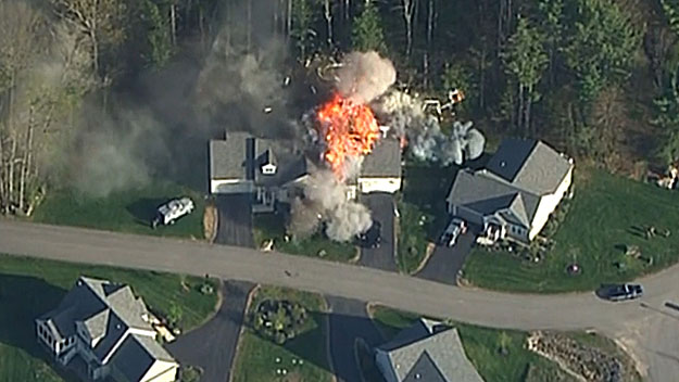 A massive explosion blew the front off the house, May 12, 2014. (WBZ-TV)