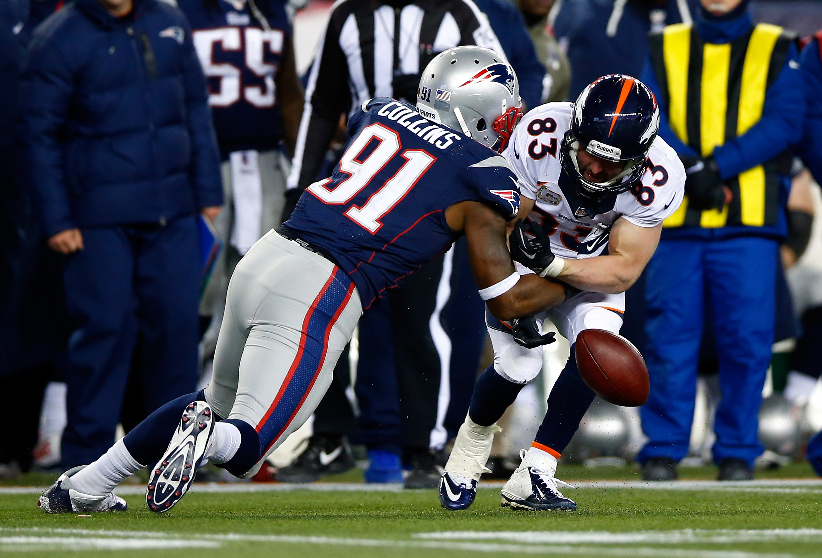 Broncos wide receiver Wes Welker cannot hold onto the ball as Patriots linebacker Jamie Collins defends.  (Photo by Jared Wickerham/Getty Images)