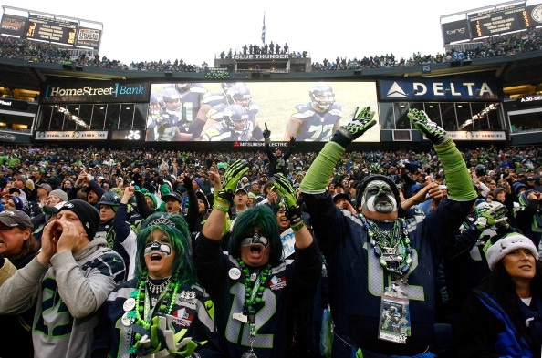 SEATTLE - DECEMBER 22: Fans of the Seattle Seahawks cheer against the Arizona Cardinals on December 22, 2013 at CenturyLink Field in Seattle, Washington. (Photo by Jonathan Ferrey/Getty Images)