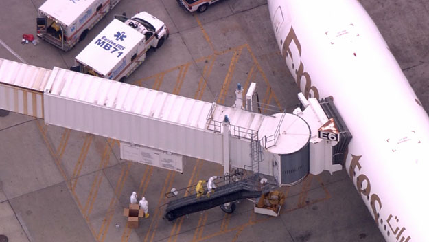 Hazmat crews board Emirates flight after medical emergency in Boston. (WBZ-TV)