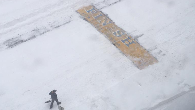 An unknown man shoveled the Boston Marathon finish line. (Image Credit: @PhillyIdol1017/Twitter)