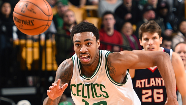 James Young battles for a loose ball against the Atlanta Hawks. (Photo by Brian Babineau/NBAE via Getty Images)