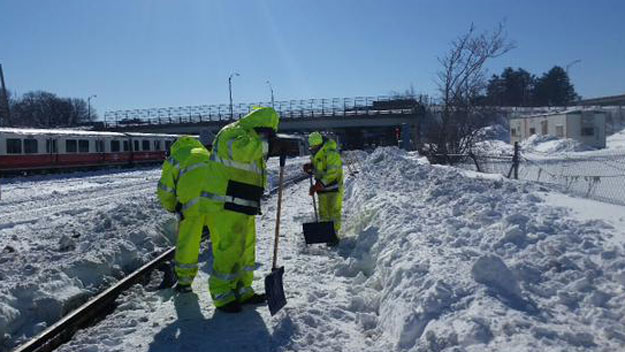 Workers shoveling out the Red Line Monday (Photo credit MBTA)