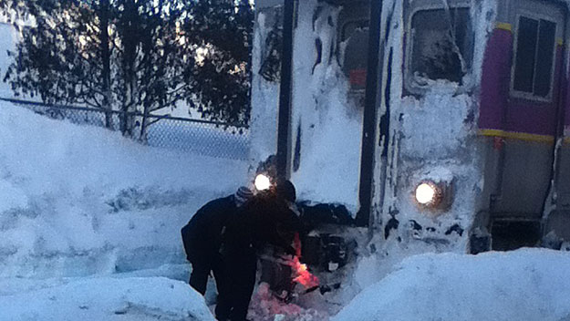 Workers tried to de-ice a stuck train in North Beverly, February 13, 2015. (Photo credit: cdelisi)
