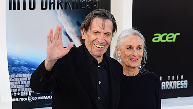 Leonard Nimoy makes his famous gesture  with his wife at the premiere 'Star Trek Into Darkness' on May 14, 2013. (Photo credit FREDERIC J. BROWN/AFP/Getty Images)