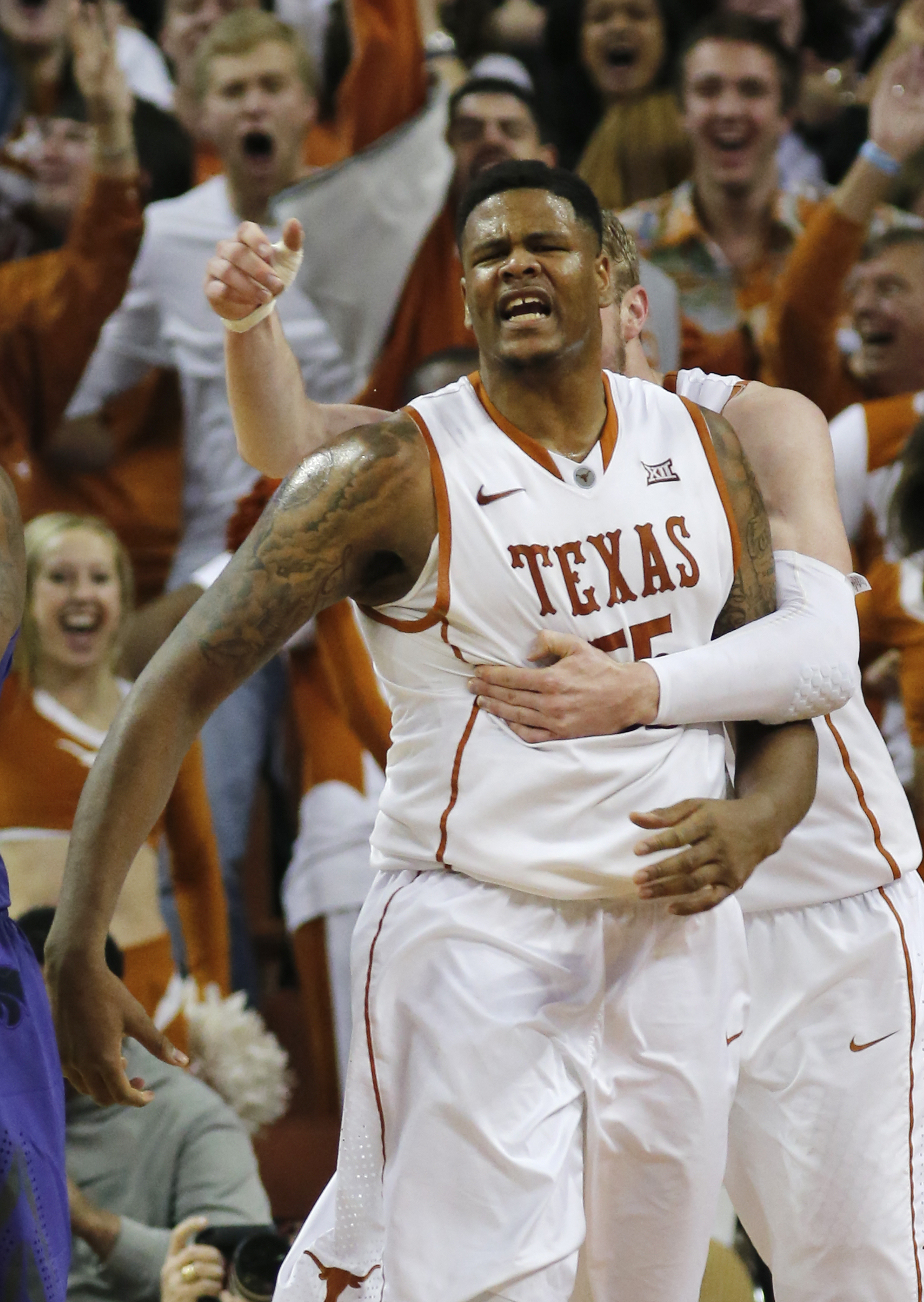Cameron Ridley #55 of the Texas Longhorns reacts after a slam dunk on March 2, 2015. (Photo by Chris Covatta/Getty Images)