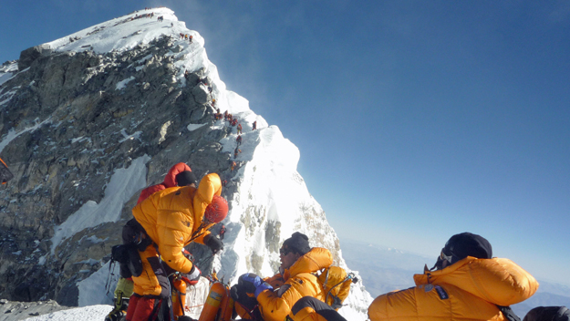 Mountaineers climb Mount Everest. (Photo by STR/AFP/Getty Images)