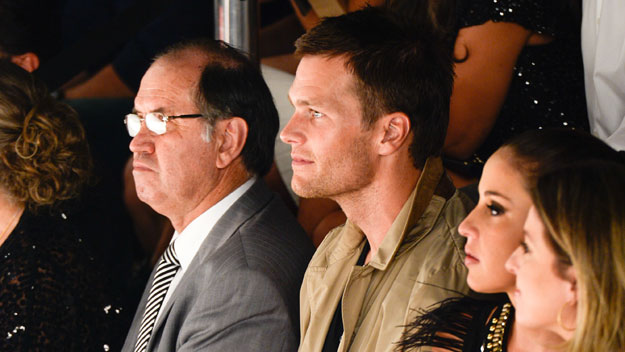 Patriots quarterback Tom Brady sits front row at his wife, Gisele Bundchen's, final runway show. (Photo by Fernanda Calfat/Getty Images)