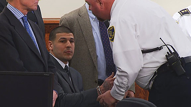 Aaron Hernandez is placed in handcuffs on April 15 after being found guilty of first degree murder. (WBZ-TV)