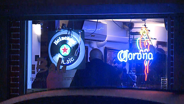 Police talked to people inside the Lawrence restaurant after the shooting. (WBZ-TV)