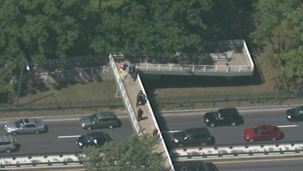 Witnesses say police shot and killed a man on a footbridge in Boston. (WBZ-TV)