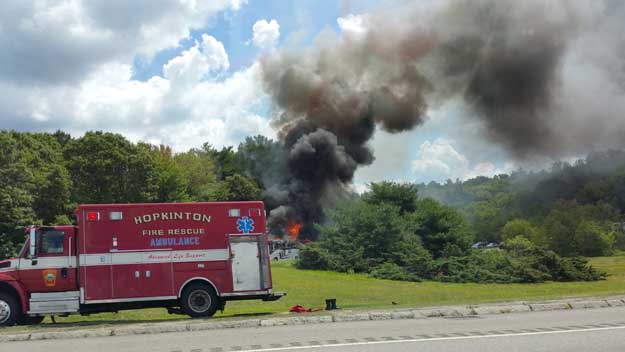 A view of the bus on fire from the Mass Pike (Photo credit Diane D'Agostino)
