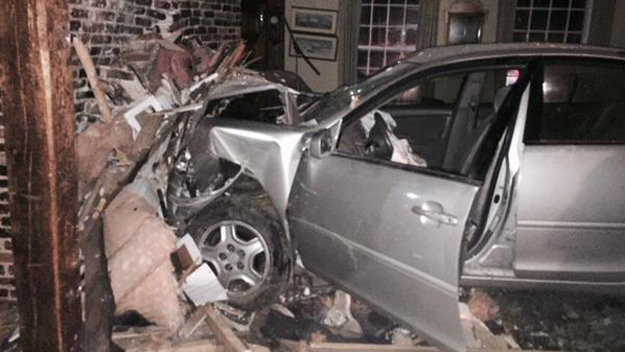 The driver of this car was hospitalized after crashing into a Halifax home. (Image Credit: Halifax Fire Department)