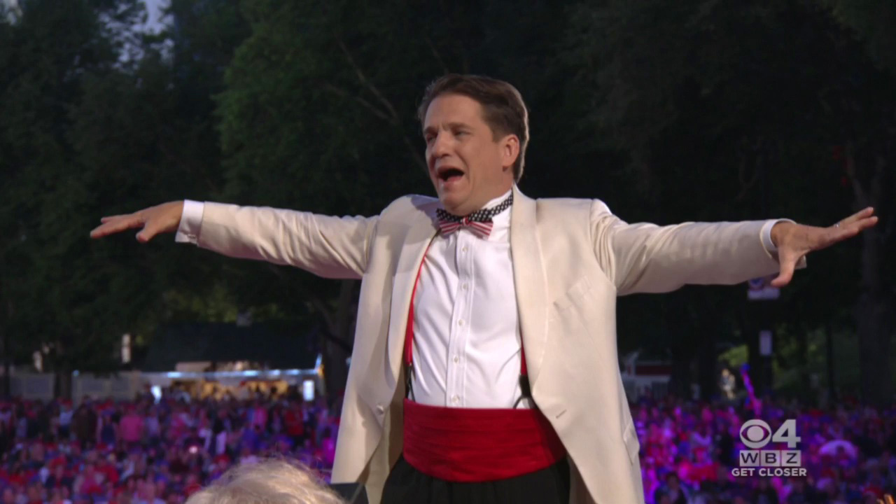Maestro Keith Lockhart conducts the Boston Pops during the 2015 July4th show on the Esplanade. (WBZ-TV)