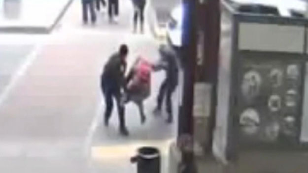 Mary Holmes is seen on video being taken down by Transit Police officers at Dudley Station in March 2014. (Image Credit: Transit Police)