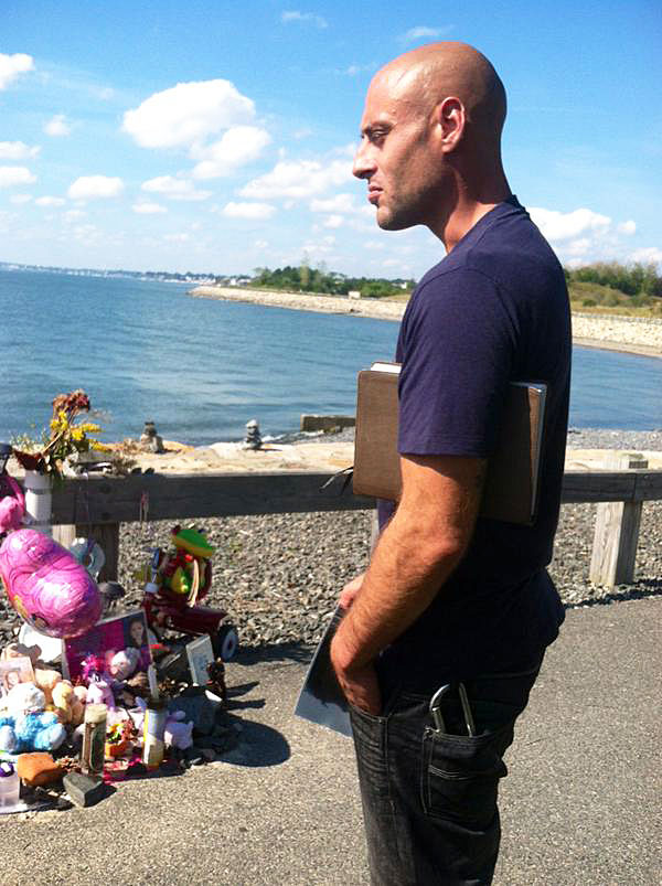 Joe Amoroso, father of Bella Bond, visits a makeshift memorial for his daughter at Deer Island in Winthrop. (Photo credit: Kim Tunnicliffe/WBZ NewsRadio 1030)