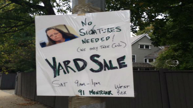 A yard sale sign with an image of Kentucky county clerk Kim Davis on it in the West Roxbury area. (Courtesy photo: @dannypetitt)