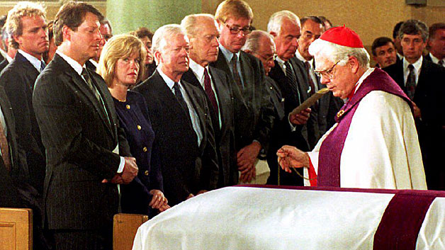 Cardinal Bernard Law blesses the casket of House Speaker Tip O'Neill on January 10, 1994. (Photo credit POOL/AFP/Getty Images)