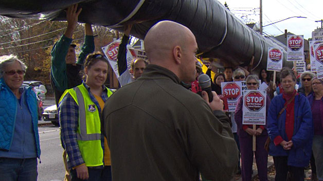 Activists hold a rally protesting a Spectra Energy pipeline project in West Roxbury on Saturday. (WBZ-TV)
