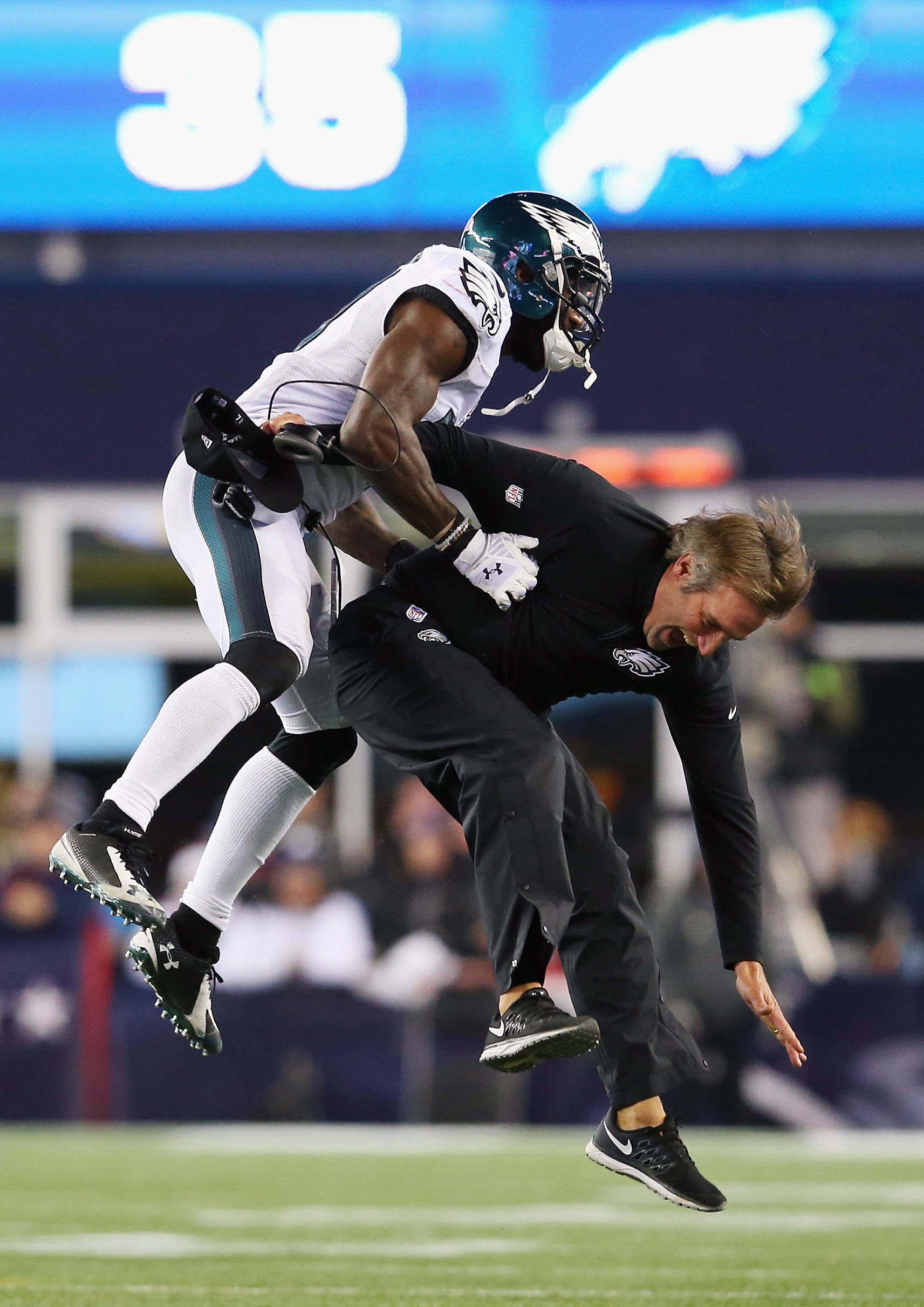 Malcolm Jenkins celebrates with defensive backs coach Cory Undlin. (Photo by Jim Rogash/Getty Images)