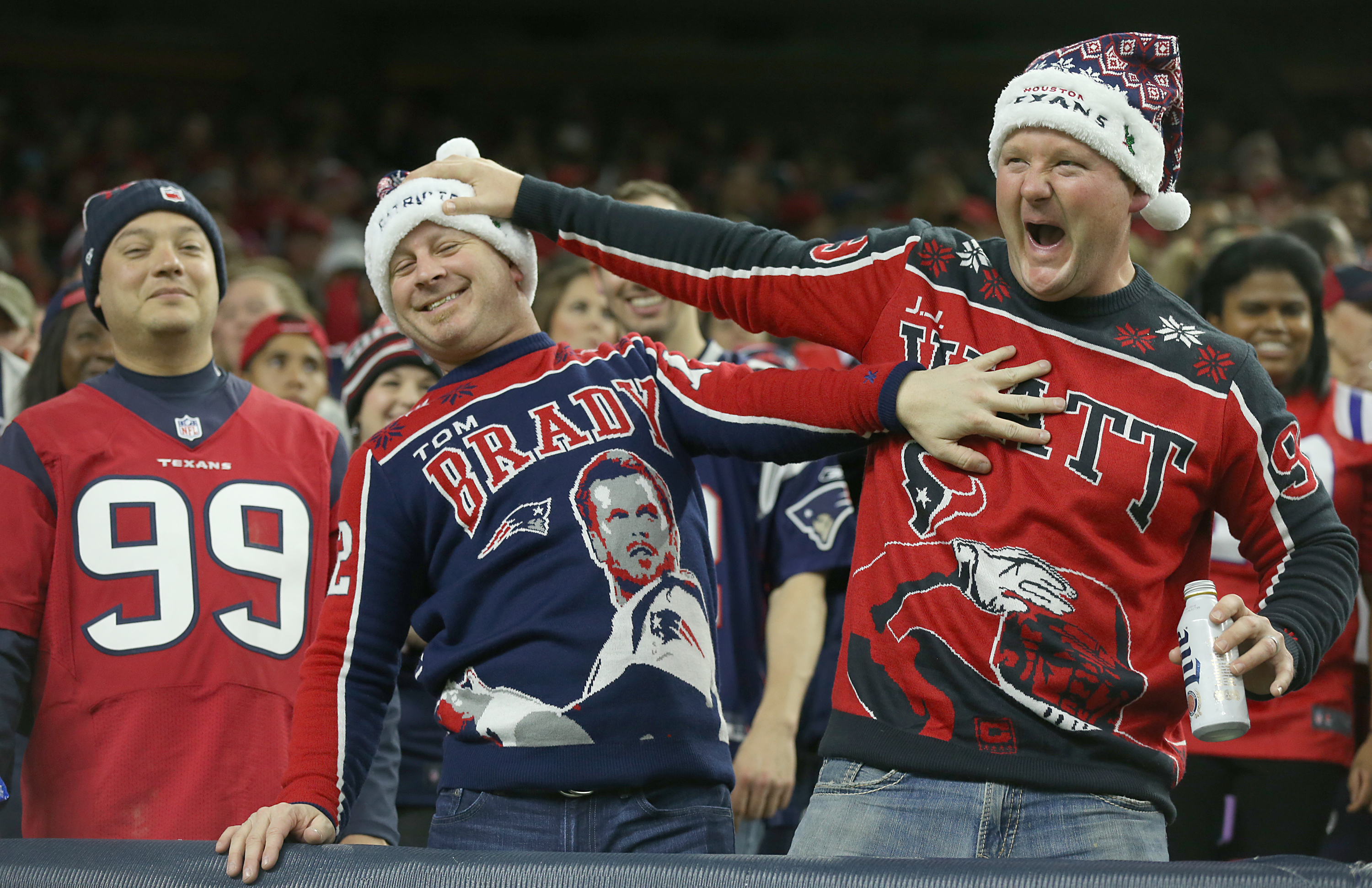 Fans of the Patriots and Texans have at it. (Photo by Scott Halleran/Getty Images)