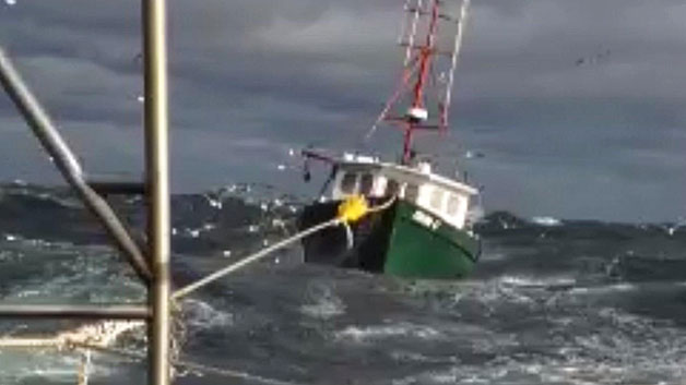 One man died and two others were rescued after their fishing boat sank Thursday off the Gloucester coast. (WBZ-TV)