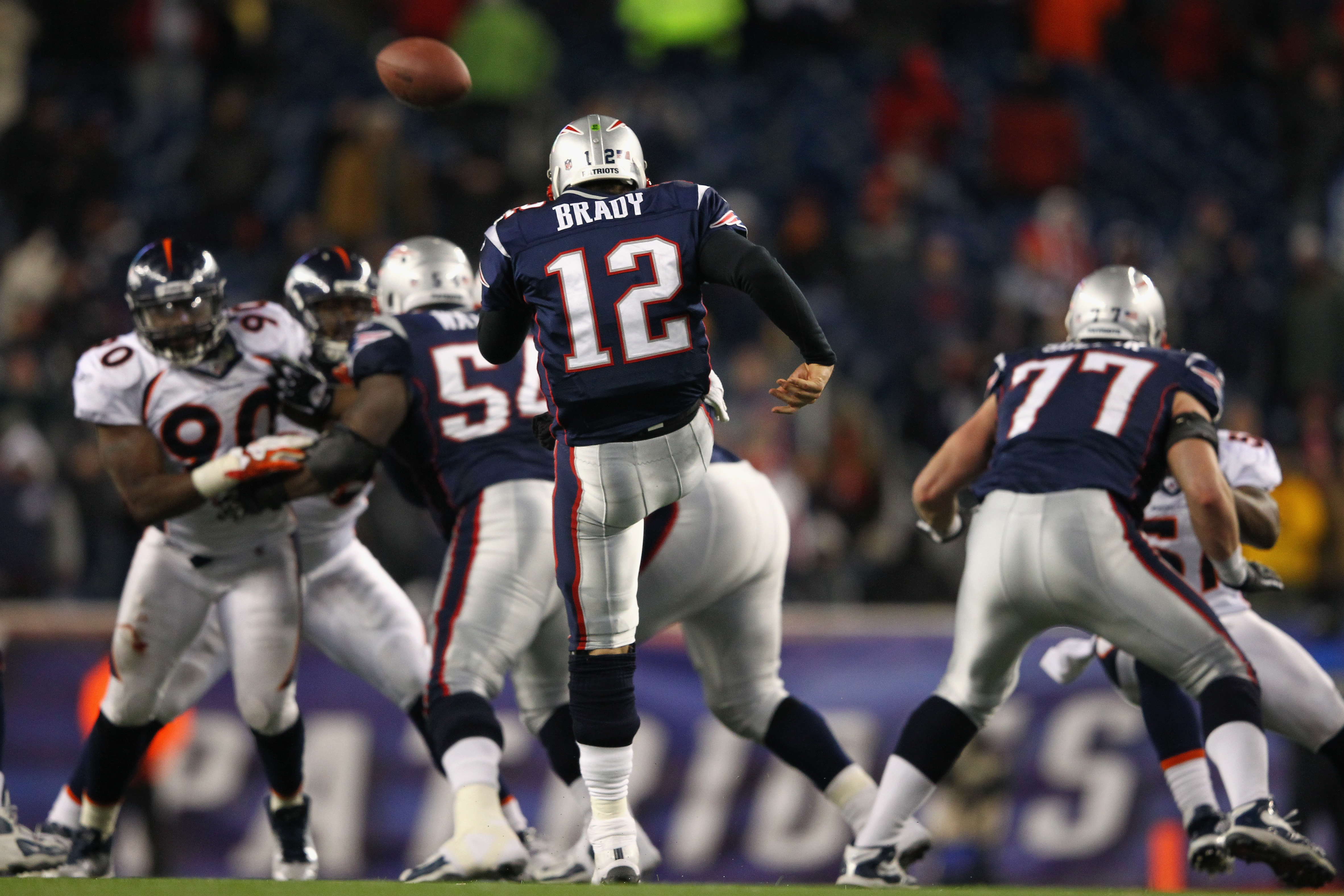 Tom Brady of the New England Patriots punts the ball in the fourth quarter against the Denver Broncos during their AFC Divisional Playoff Game at Gillette Stadium on January 14, 2012 in Foxboro, Massachusetts. (Photo by Al Bello/Getty Images)