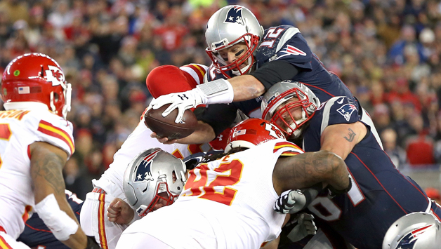 Tom Brady reaches over the goal line against the Chiefs. (Photo by Jim Rogash/Getty Images)
