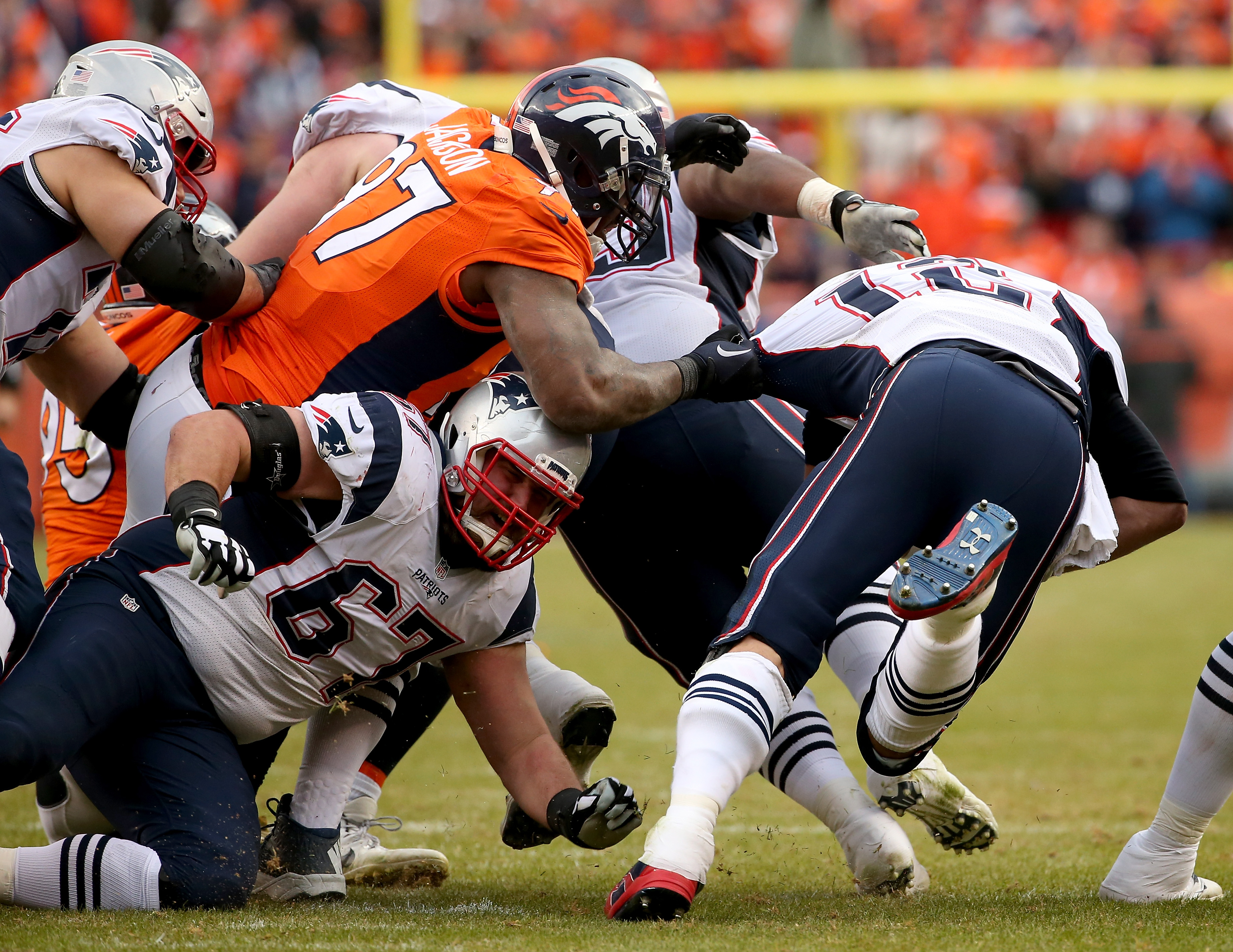 Tom Brady gets pulled down by Malik Jackson. (Photo by Doug Pensinger/Getty Images)