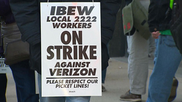Verizon workers on the picket line outside the Verizon Building in Bowdoin Square in downtown Boston Wednesday. (WBZ-TV)