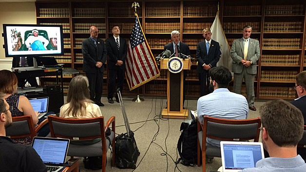 Officials including Suffolk County District Attorney Dan Conley and Boston Police Commissioner Bill Evans announce an arrest made in a 1987 Roxbury cold case murder. (Matt Colson/WBZ-TV)