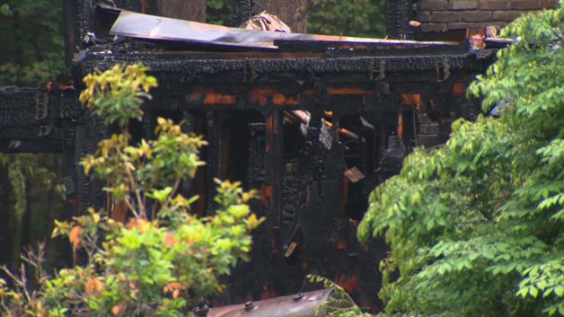 A Concord home is a total loss following a massive house fire. (WBZ-TV)