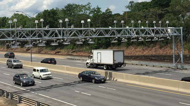 Electronic toll gantry above Mass. Pike in Newton (WBZ-TV)