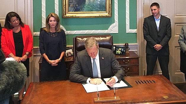 Gov. Baker signed the riding-sharing bill into law Friday, Aug. 5, 2016 (WBZ-TV)