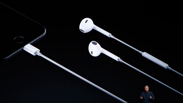 Apple Senior Vice President of Worldwide Marketing Phil Schiller introduces Lightning headphones (Photo by Steven Lam/Getty Images)