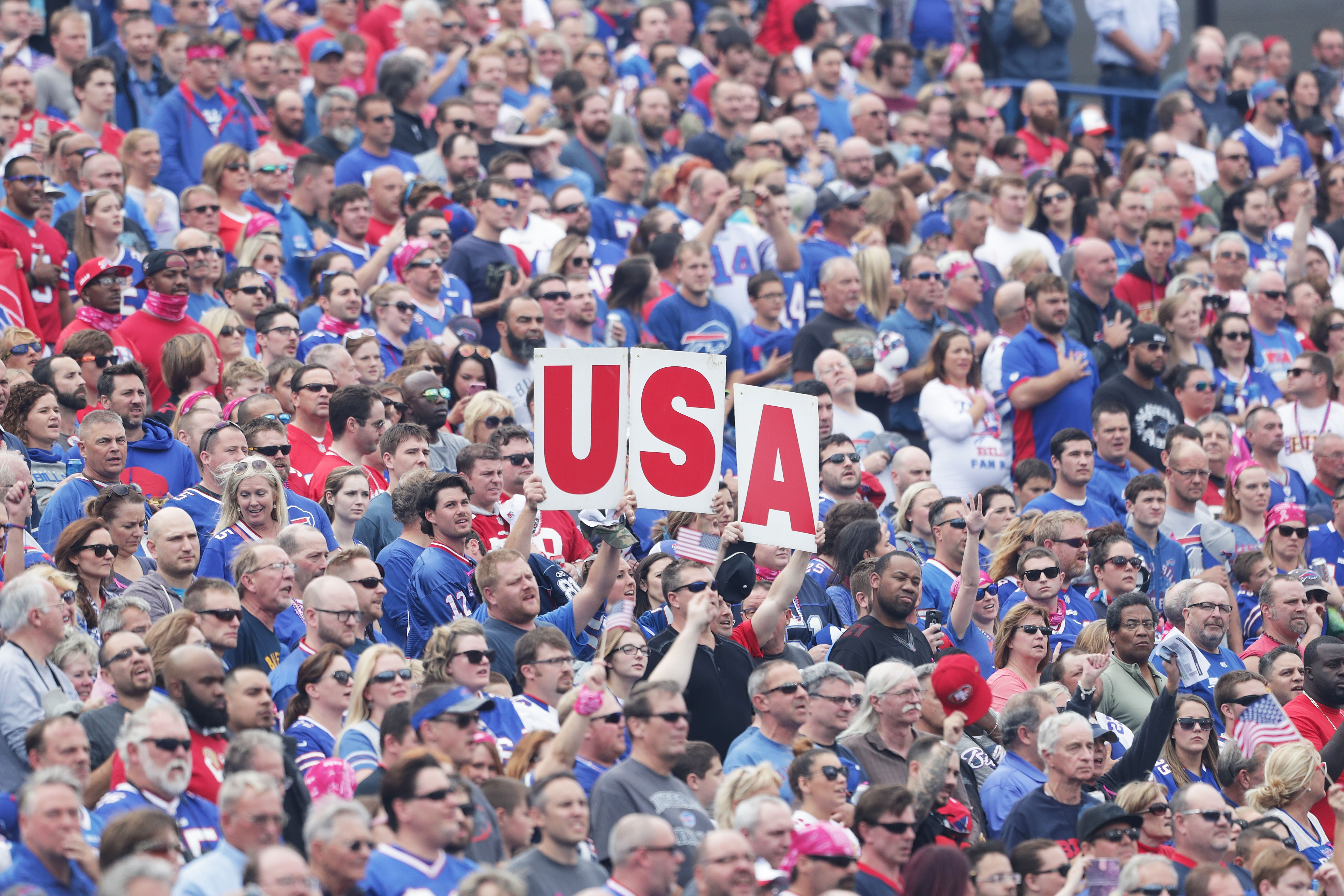 Fans hold up a "USA" sign during the national anthem before the game between the San Francisco 49ers and Buffalo Bills on October 16, 2016 in Buffalo, New York. (Photo by Brett Carlsen/Getty Images)