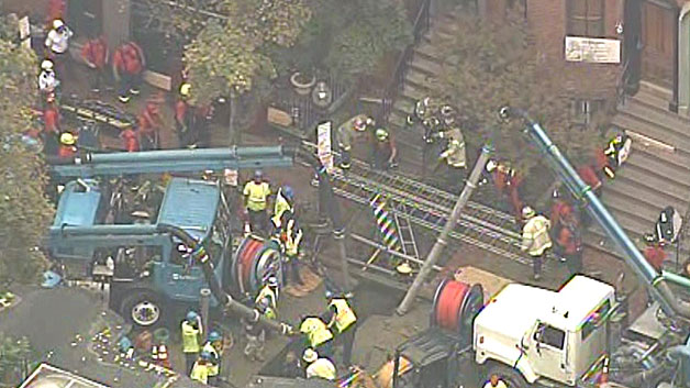 Crews worked frantically to drain the trench on Dartmouth Street Friday afternoon. (WBZ-TV)