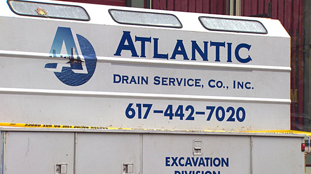 Atlantic Drain Service employed the two workers killed when a trench flooded in the South End. (WBZ) 