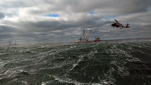 Coast Guard crews worked to rescue six crewmembers from a sinking fishing vessel in Buzzard's Bay Sunday morning. (Photo credit - New Bedford Fire Department)