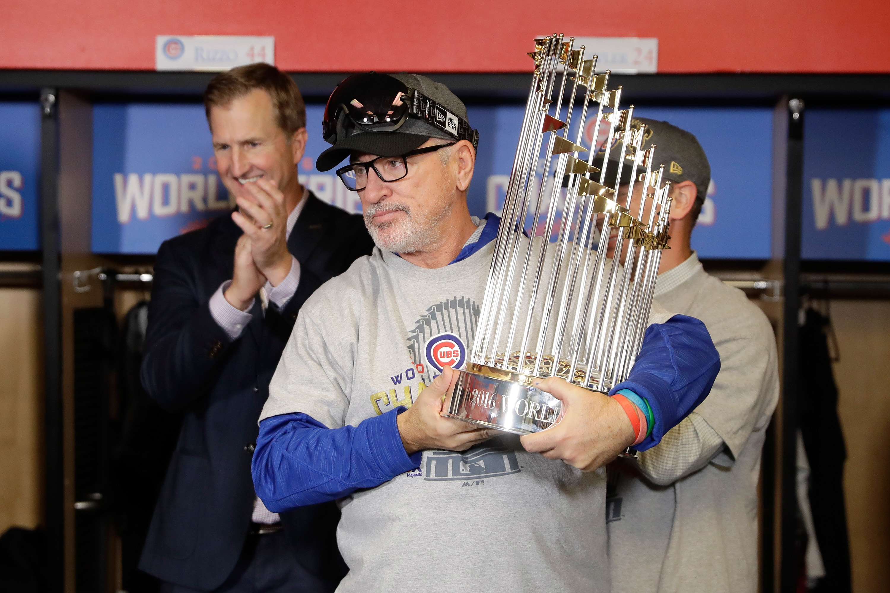 Joe Maddon reacts with The Commissioner's Trophy after the Chicago Cubs defeated the Cleveland Indians 8-7 in Game Seven of the 2016 World Series. (Photo by David J. Phillip-Pool/Getty Images)