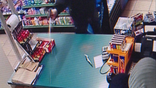 Surveillance video shows armed robbery firing gun at Hyannis store (WBZ-TV)